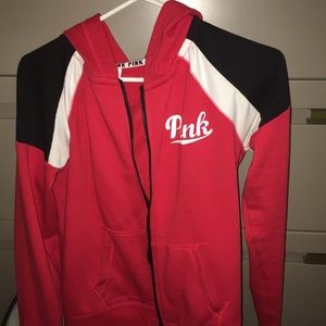 Pink red black and white sweater,but no stains